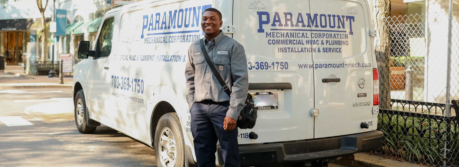 Man standing in front of van.