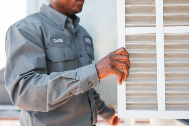 Man opening window.